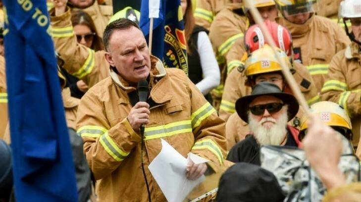 United Firefighters Union secretary Peter Marshall addresses a rally at Parliament House in June. Photo: Justin McManus