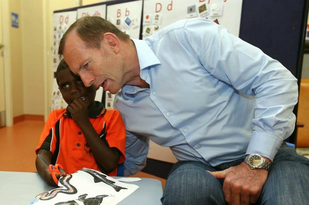 Prime Minister Tony Abbott, who is currently spending a week in the Northern Territory, says his assessment of ministers is "perfectly normal".  Photo: Alex Ellinghausen