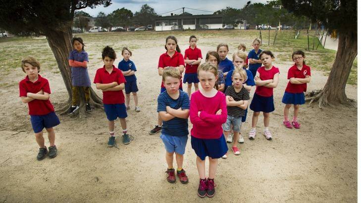 Footscray Primary School students on the oval where asbestos has been found.
 Photo: Simon O'Dwyer