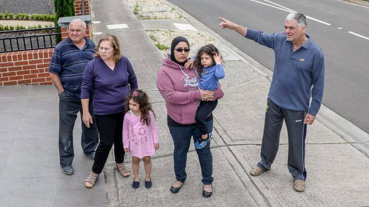 L-R Sam and Carmela Frietta, children Sulayman and Asmaa with mum Jamal Elhussein and Drage Avtarovski are all concerned about the asbestos dump in their neighbourhood. Photo: Justin McManus