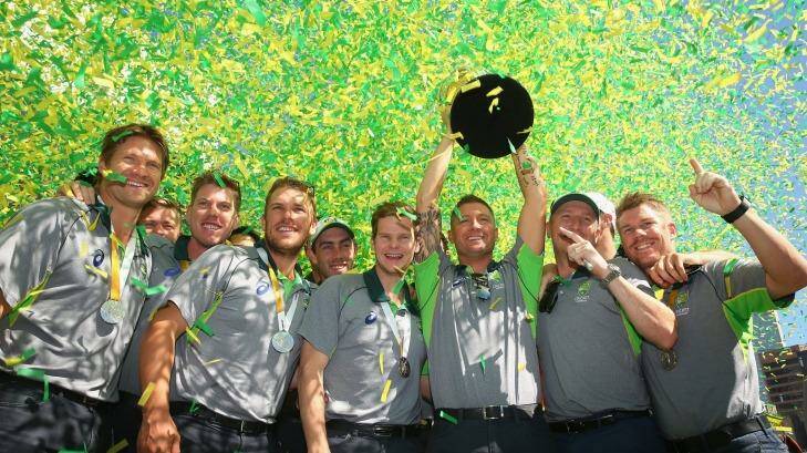The Australian cricket team poses with the World Cup trophy at Federation Square. Photo: Quinn Rooney