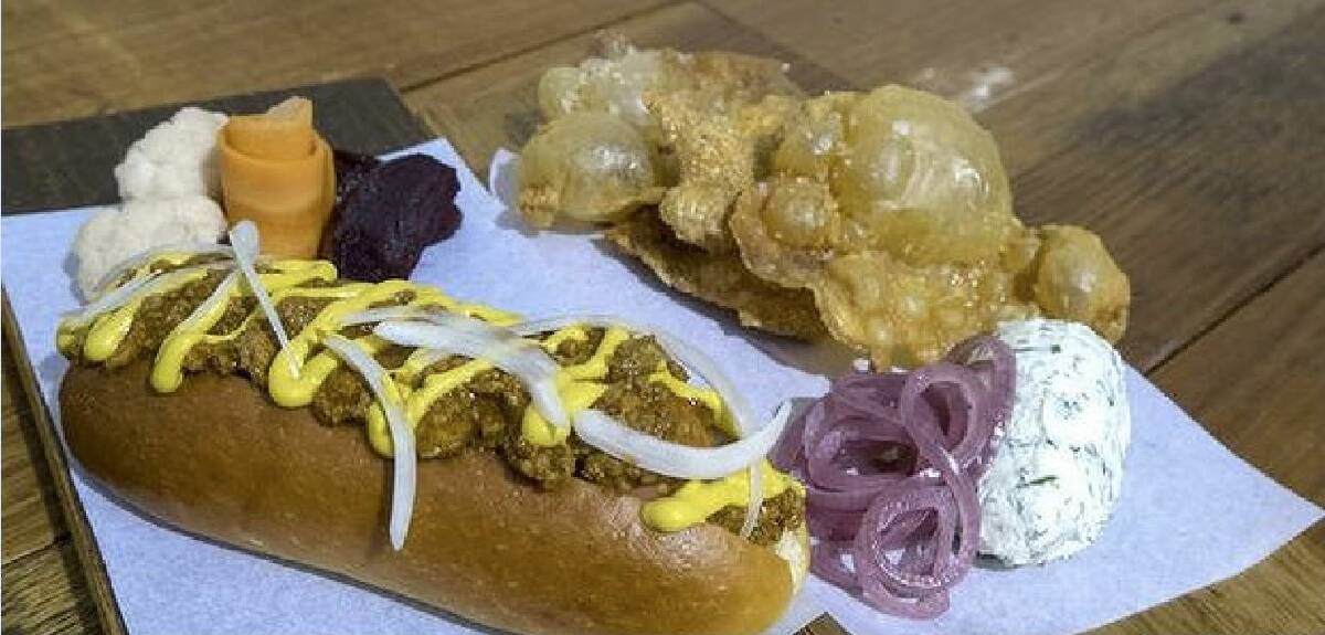 Signature dishes: The gribenes (fried chicken skins) and smoked hotdog. Photo: Luis Ascui/Getty Images