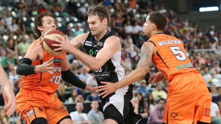 Crowded lane: Melbourne United veteran Mark Worthington tries to evade the Cairns defence. Photo: Mick Connolly