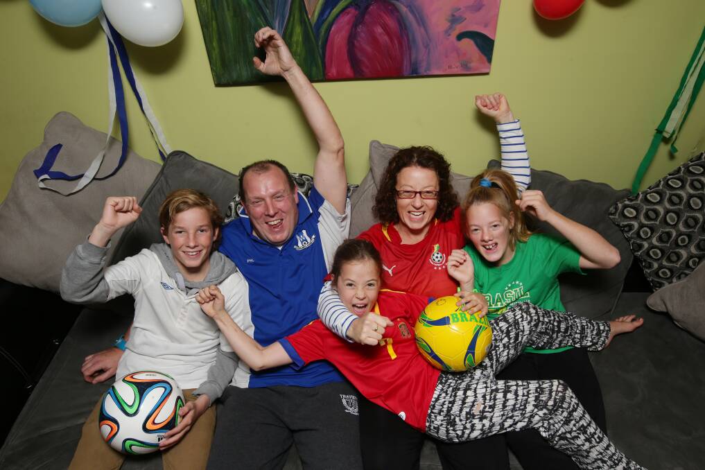 Liam Burns (left), 14, Phil Burns, Scarlett Burns, 9, Carolyn Lehmann, and India Burns, 12, have watched the World Cup live. Picture: AARON SAWALL 