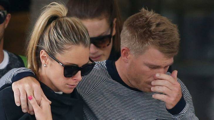 David Warner, accompanied by his wife Candice Falzon cries as he leaves the hospital on Thursday.  Photo:  Daniel Munoz