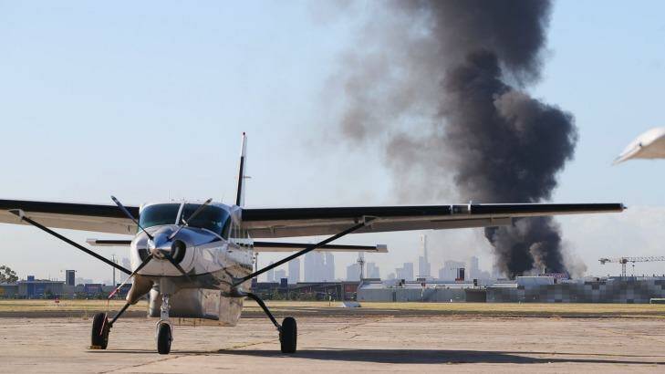 A plume of smoke is seen from Essendon airport on Tuesday. Photo: Michael Dodge