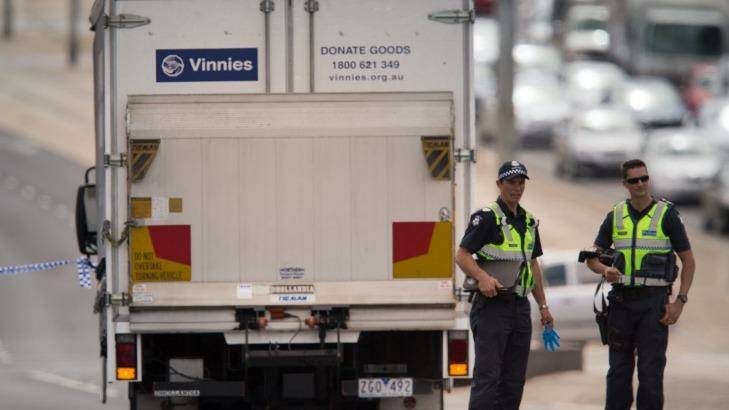 Police at the scene where the woman died after being hit by a truck in Bundoora. Photo: Jason South