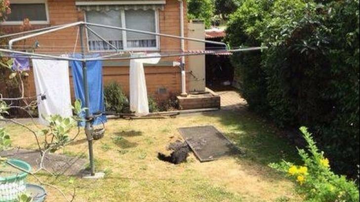 The hole in the backyard of the Springvale South home. Photo: Nine News, via Twitter.