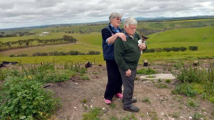 Fran and Reg Cleland at the site of their house which was razed in the fire. Photo: Joe Armao