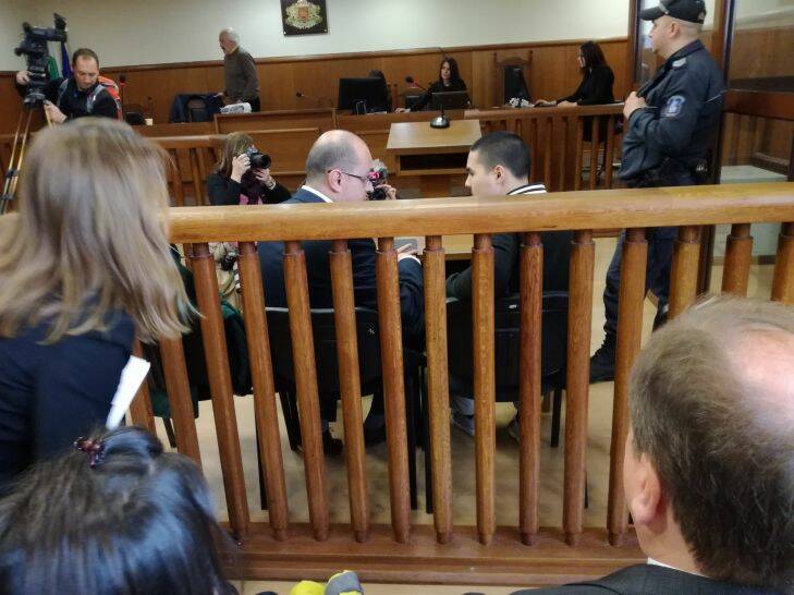 Bulgarian lawyer Histro Botev speaks with his client Australian John Zakhariev, right seated, in court in Sofia on Friday. Photo: Teodor Spasov