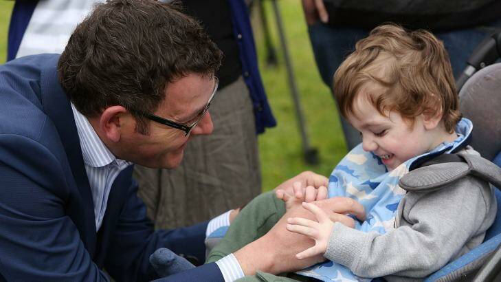 Daniel Andrews with Cooper Wallace before the Victorian election. The now Premier is pushing for a bill to legalise medical marijuana before parliament before the end of next year. Photo: Graham Denholm