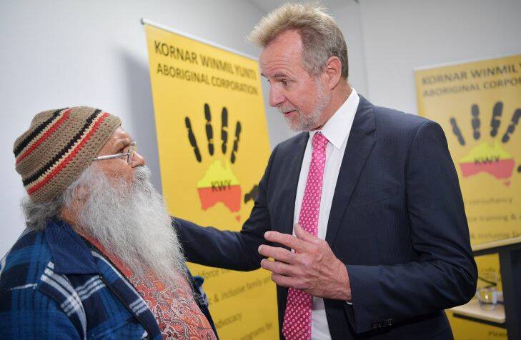 Federal Minister for Indigenous Affairs, Nigel Scullion, speaks to Local Elder Uncle Moogi at the Kornar Winmil Yunti Aboriginal Corporation in Adelaide. Wednesday, July 19, 2017. (AAP Image/David Mariuz) NO ARCHIVING