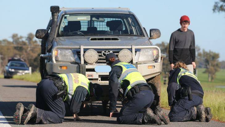 Police inspect the first vehicle involved in the Barnawartha North crash.  Photo:  Mark Jesser/Border Mail