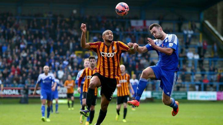 Aerial contest: James Meredith is challenged by Ben Williams of Halifax Town last season. Photo: Clive Rose