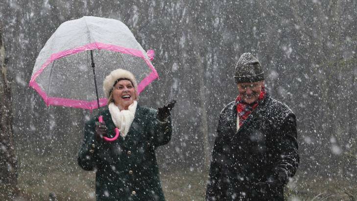 Gloria and Bill Reeves enjoy the snow falling at Mt Macedon on June 24, 2016 in Melbourne. Photo: Paul Rovere