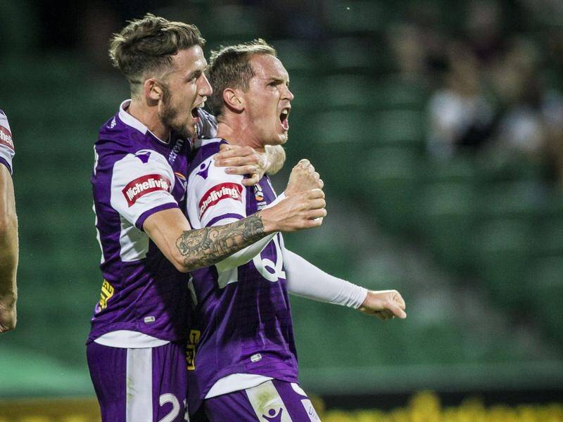 Neil Kilkenny (right) celebrates his A-League goal for Perth against former club Melbourne City.