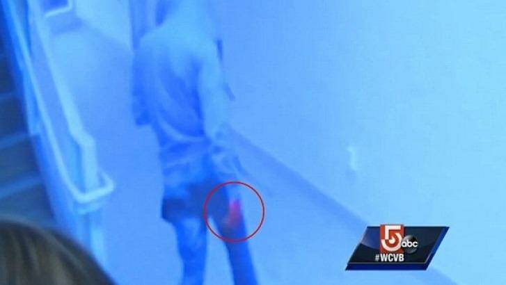 A male police allege is Philip Chism leaves the bathroom, his right hand visibly red. Photo: WCVB/ABC 5