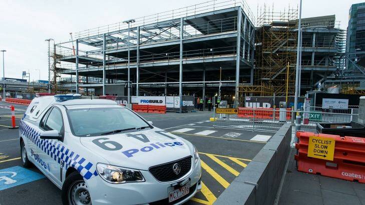 A police car at the South Wharf construction site where a worker was killed on Wednesday. Photo: Paul Jeffers