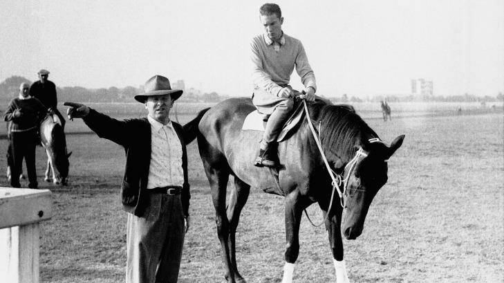 Controversial performance: The 1960 Melbourne Cup runner Tulloch with trainer Tommy Smith. Photo: Baden Mullaney