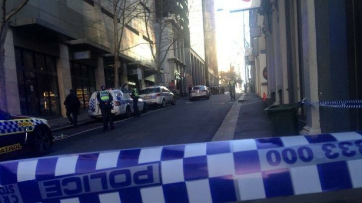 Police have cordoned off Little Bourke Street as they examine the scene. Photo: Marissa Calligeros