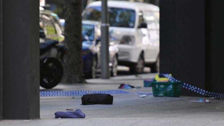 Belongings scattered in Bourke Street after pedestrians were struck by a car.  Photo: Eddie Jim