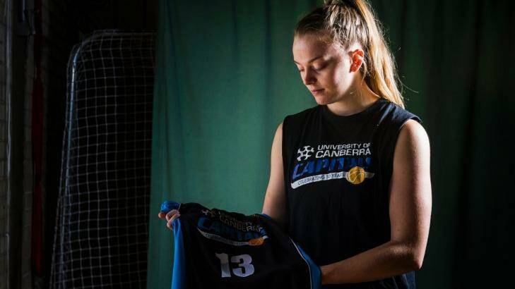Canberra Capital Abigail Wehrung with her No. 13 jersey as a tribute to her father, who died 12 years ago. Photo: Elesa Kurtz