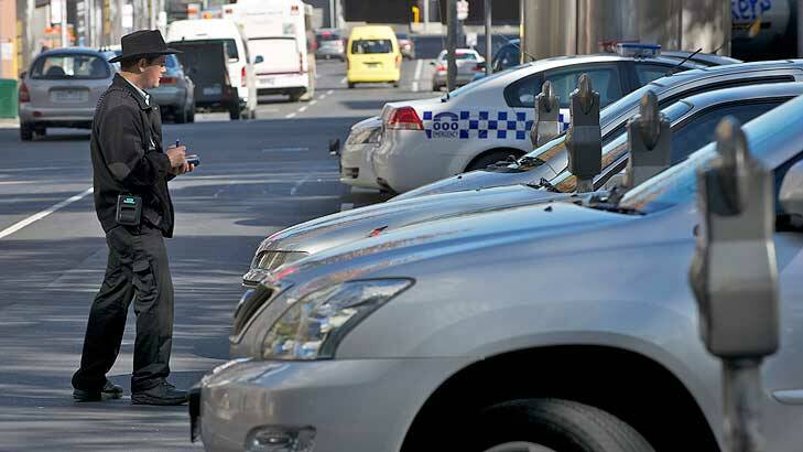 A parking inspector works in Lonsdale Street. Photo: Wayne Taylor