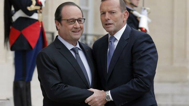 French President Francois Hollande welcomes Prime Minister Tony Abbott to the Elysee Palace, in Paris, on Monday. Photo: Francois Mori