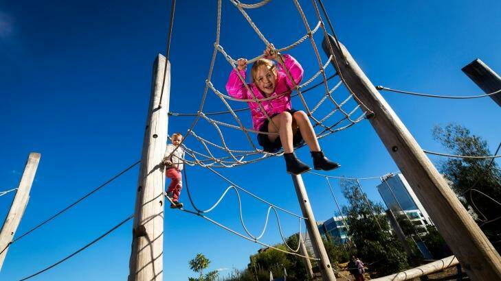 Anna, 6, hangs around at the playground. 
 Photo: Chris Hopkins