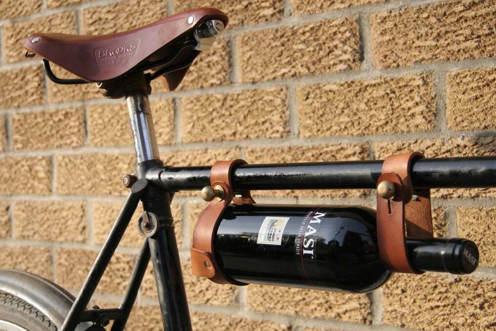 Carry a traveller: Leather wine bottle rack by Oopsmark, $49.95, cyclestyle.com.au Photo: Supplied