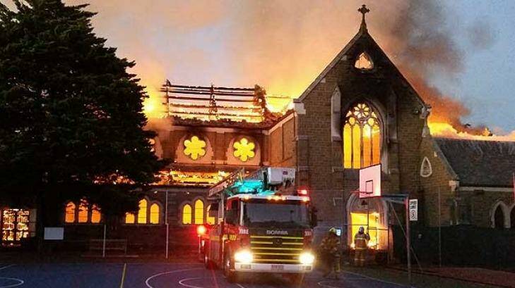 Fire tears through the historic St James Church. Photo: Garry Furlong