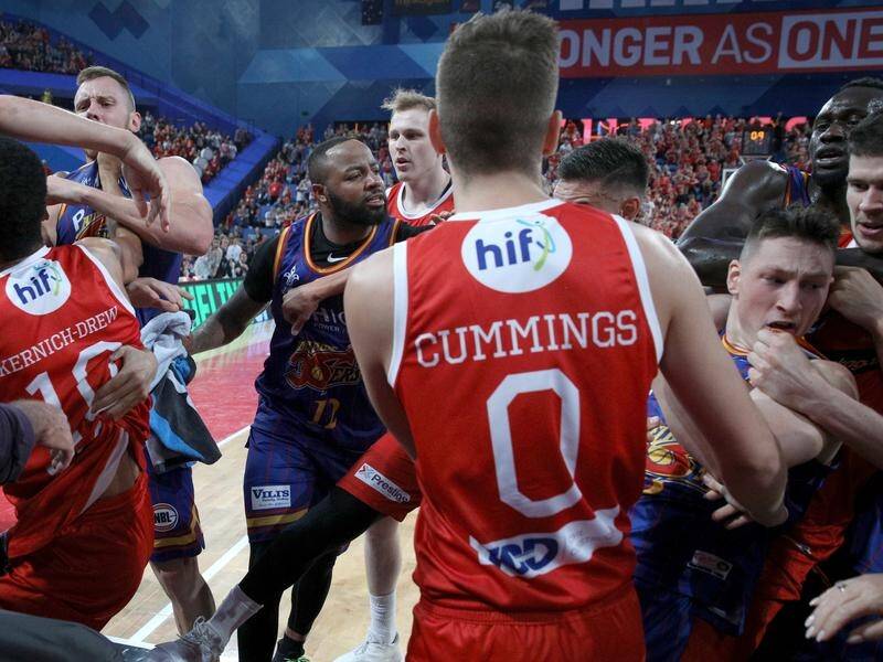 Wildcats and 36ers players confront each other in an ugly brawl during the match at Perth Arena.