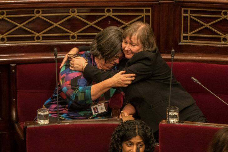 Members of the Victorian Upper house celebrate with hugs and tears of joy after a marathon 29 hours sitting to pass the Voluntary Assisted Dying Bill. Greens MP's Colleen Hartland asnd Samantha Dunn .22nd November 2017. Photo by Jason South