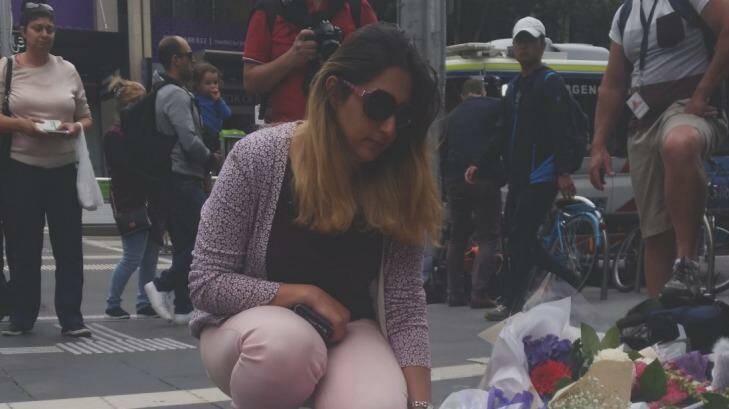 Aida lays flowers in the Bourke Street Mall. Photo: Supplied