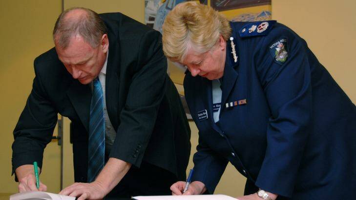 In happier times: Police Association boss Paul Mullett and chief commissioner Christine Nixon sign a police pay deal in 2007. Photo: Victoria Police