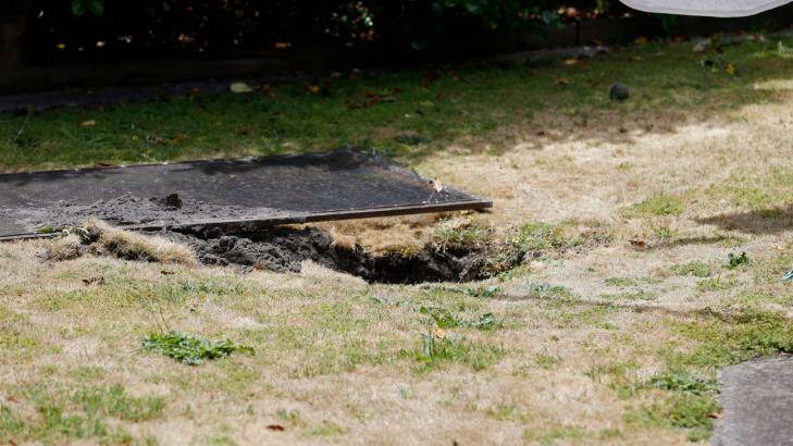 The sinkhole in the backyard of the Springvale South home. Photo: Eddie Jim
