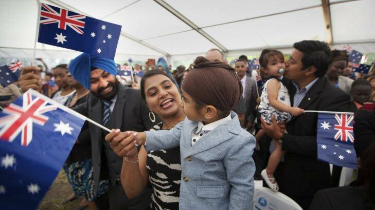 The 220 people who took the citizenship oath at Sunshine on Monday received a gum tree sapling and a handshake from Opposition leader Bill Shorten. Photo: Simon O'Dwyer