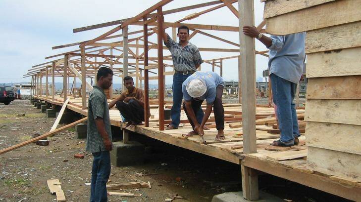 Building barracks in Aceh as temporary accommodation to house homeless tsunami victims. Photo: Bill Nicol
