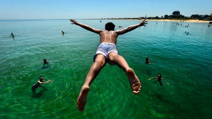 Get set to swelter, or find a way to cool off - like this young man at the Frankston Jetty. Photo: Justin McManus