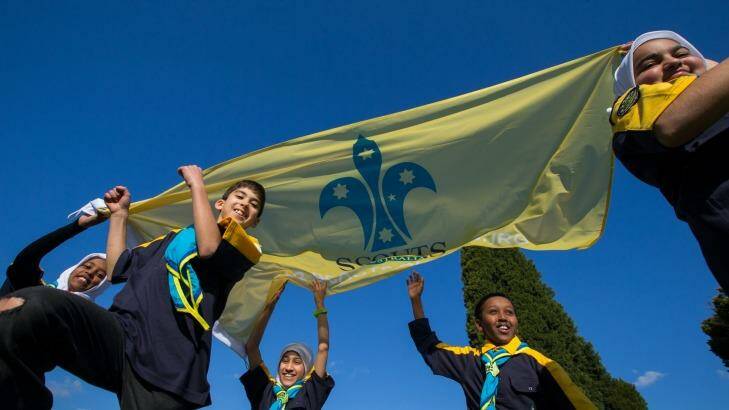Flying the flag: newly minted cub scouts Jamila, Mostafa, Ryka, Yahya and Wafaa at their investiture cermemony. Photo: Jason South