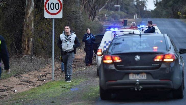 Police on Hermitage Road in Maiden Gully, where the missing teen was found. Photo: Bendigo Advertiser.