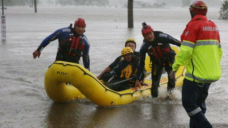 The couple are pulled to safety after their rescue.
 Photo: Peter Stoop 