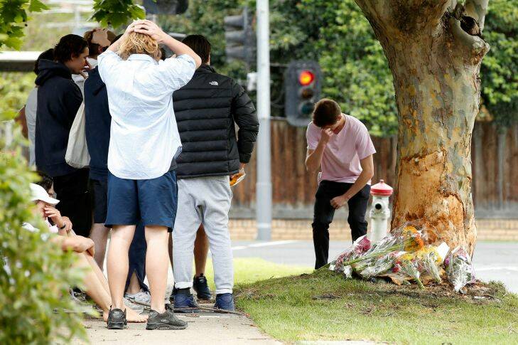 MELBOURNE, AUSTRALIA - November 17 . Class mates and friends arrive at the scene of a single car accident in Glen Iris that killed a young man on November 17, 2017 in Melbourne, Australia. (Photo by Darrian Traynor)