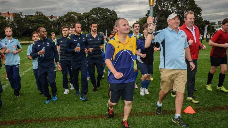 Putting something back: Spurs and Sydney FC players conducted a coaching clinic for members of the Special Olympics football team at Birchgrove Oval on Friday. Photo: Brendan Esposito