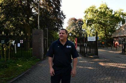 Australian Federal Police Senior Sgt Rod Anderson who was the head of the Disaster Victim Identification team at the MH17 crash site and later in The Hague, stands at the front gates of Hilversum military base where the bodies of the MH17 victims were brought once they landed in the Netherlands and where the DVI proccess took place. Photo: Kate Geraghty