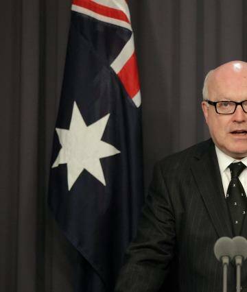 Attorney-General George Brandis's office said an expensive dinner on taxpayers during a visit to London was usual practice.  Photo: Alex Ellinghausen
