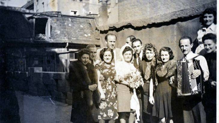 Erna and Wilek Rosner's wedding in Munich, Germany in September 22,1946. Oskar Schindler is the tall man in the back. Leo Rosner with accordion; Rosner's wife Helen is left of him.
 Photo: Supplied