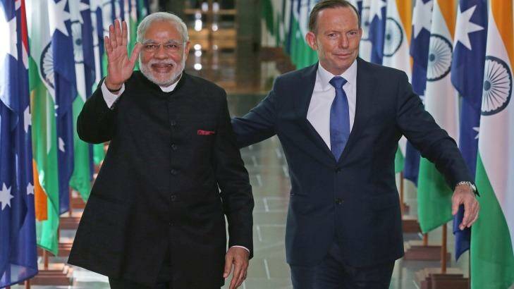 India's Prime Minister Narendra Modi and Prime Minister Tony Abbott, leave the House of Representatives at Parliament House following the G20 summit. Photo: Rick Rycroft
