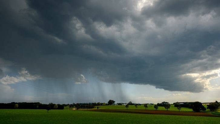 Rain and storm clouds on the outskirts of Lancefield on Friday. Photo: Justin McManus