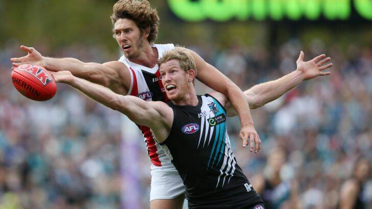 St Kilda's Tom Hickey (left) contests for a throw-in with Port Adelaide's Matthew Lobbe during the round one AFL match between the Port Adelaide Power and the St Kilda Saints at Adelaide Oval, Adelaide, Sunday, March 27, 2016. (AAP Image/Ben Macmahon) NO ARCHIVING, EDITORIAL USE ONLY Matthew Lobbe